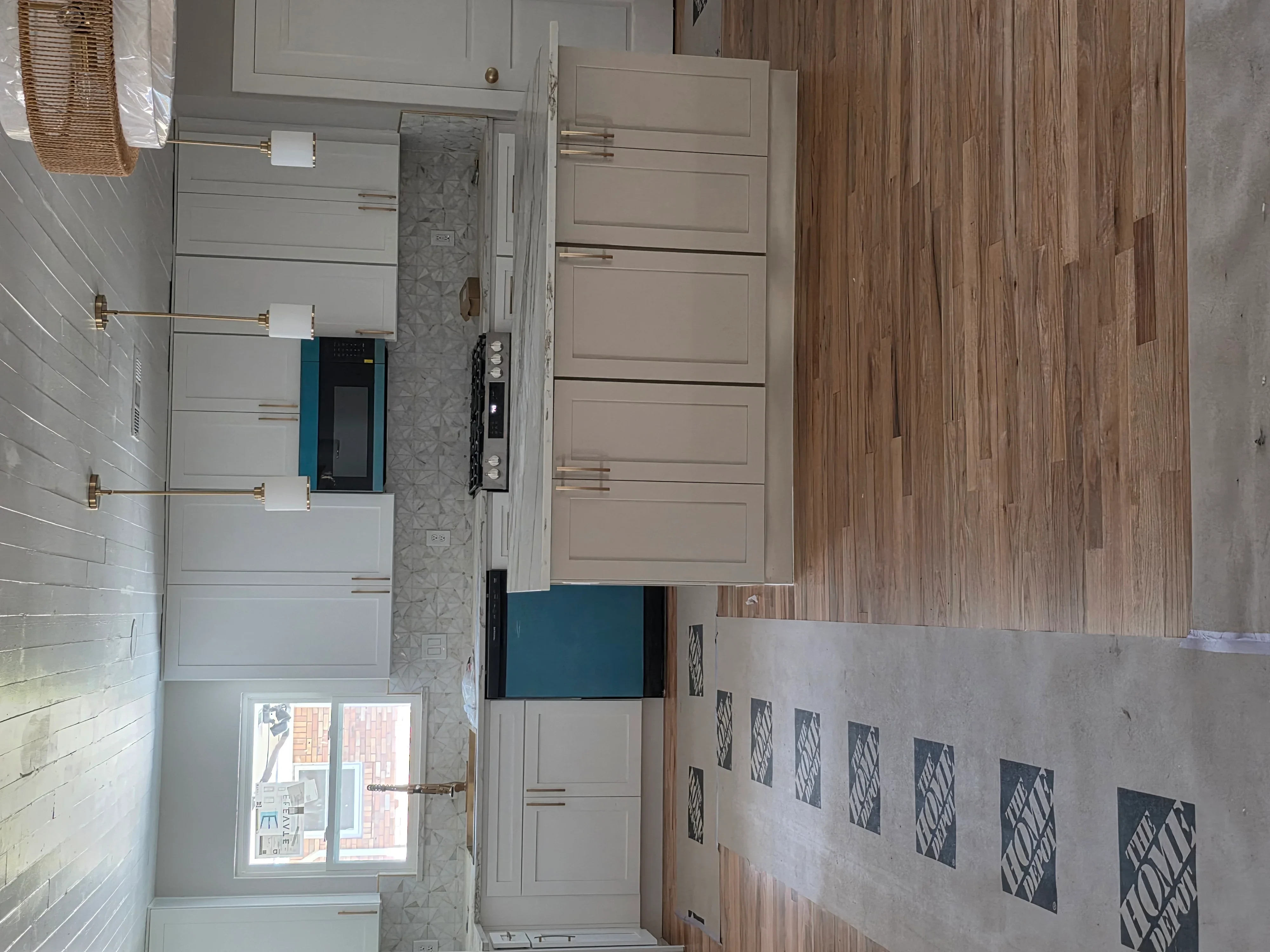 Kitchen bathroom electrical installation with outlets, switches, and wiring integrated with cabinetry and tile