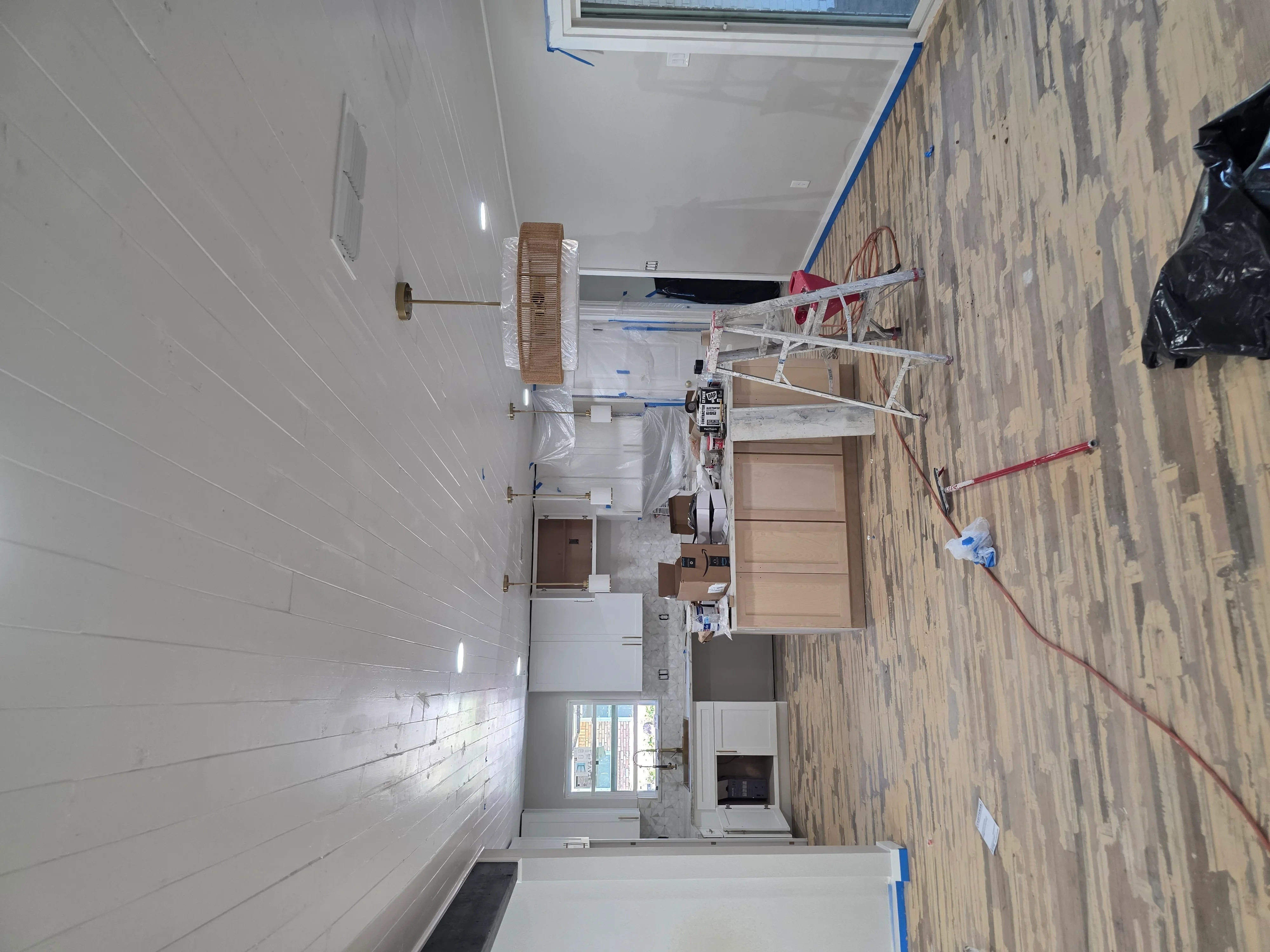 Electrical rough-in with conduit, wiring, and outlet boxes in kitchen and bathroom renovation