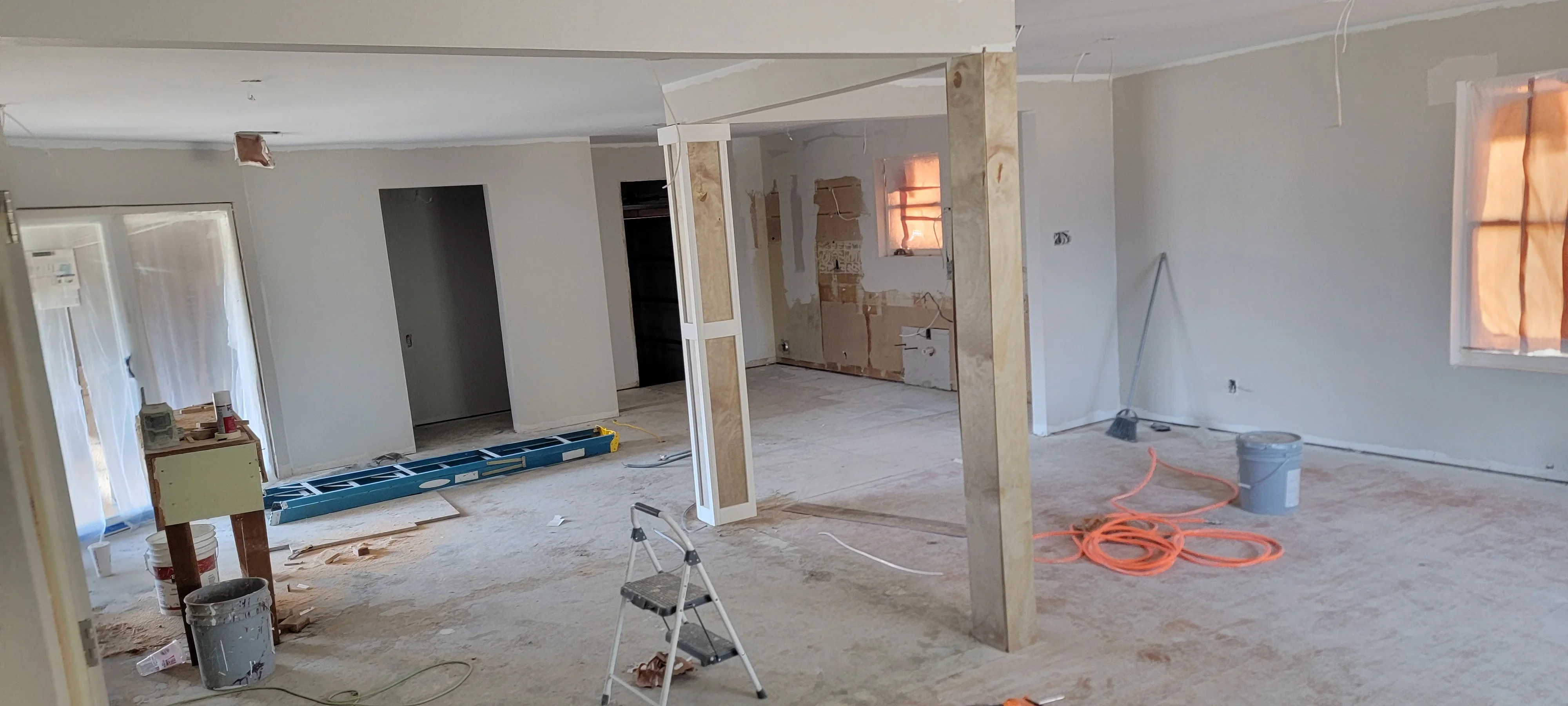 Commercial interior electrical rough-in with conduit, outlet boxes, and wiring in multi-room space